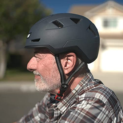 A man wearing a Xnito Bike Helmet with LED Lights Adults Men Women while riding a motorcycle.