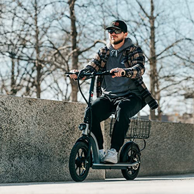 A man riding a Hiboy Ecom 14 electric scooter on a sidewalk.