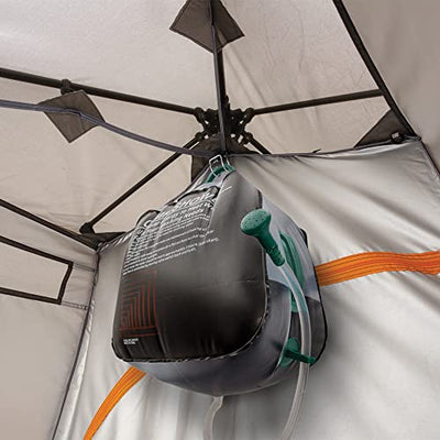 The inside of a Bushnell Shower Tent with Instant Setup Technology with a boxing glove hanging from it.