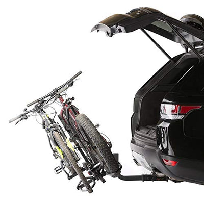 A KAC car with a KAC KR-BRDUBK Heavy Duty K2 Sport 2 Inch Hitch Rear Mounted 2-Bike Bike Rack attached to the back of it.