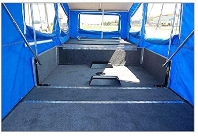 The inside of a Time Out Trailers Easy Camper Trailer Pull Behind Motorcycle or Small Car with blue tarps.